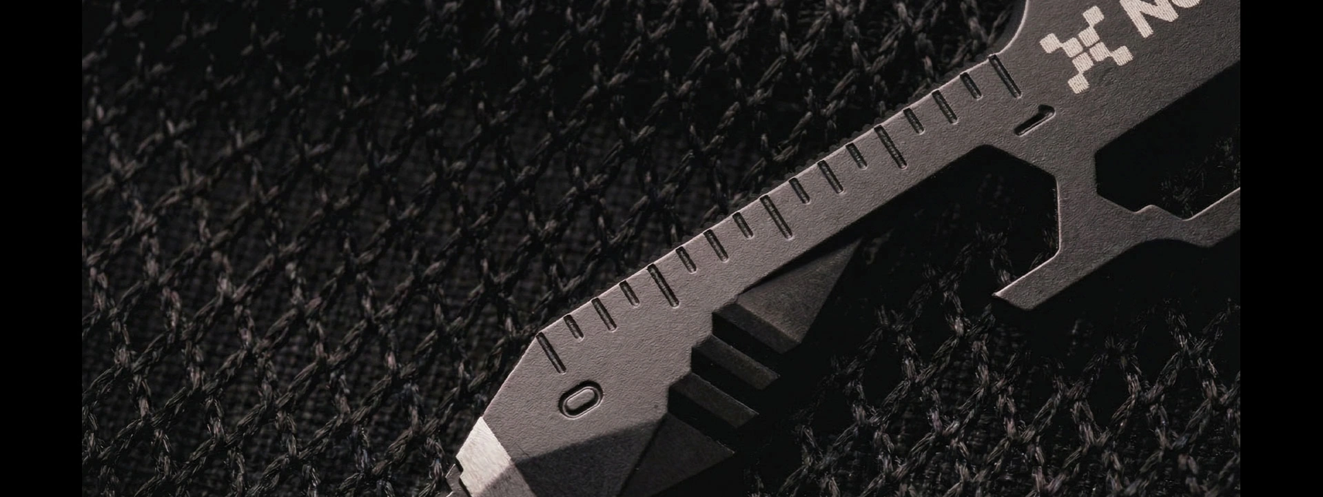 Nocpix multiverktygsnärbild på tyg.